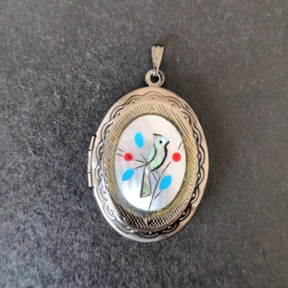 Vintage locket pendant with mother of pearl w hand carved bird